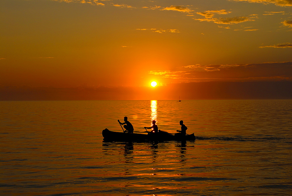 People rowing home at sunset at Ifaty, near Toliara, Madagascar, Indian Ocean, Africa