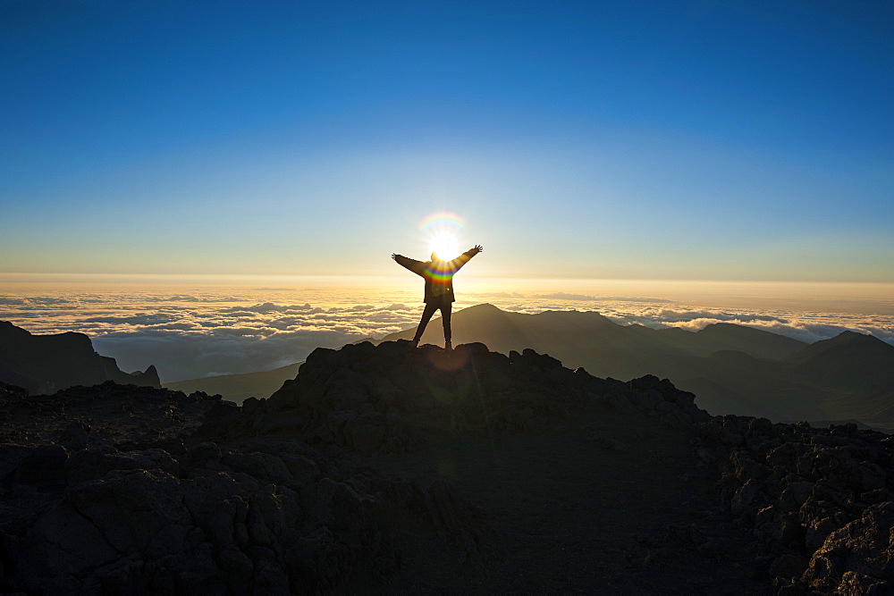 Tourists in backlight waiting for sunset, Haleakala National Park, Maui, Hawaii, United States of America, Pacific