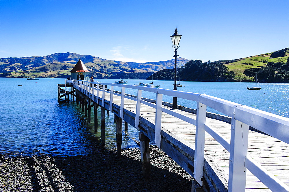 Long wooden pier in Akaroa, Banks Peninsula, Canterbury, South Island, New Zealand, Pacific