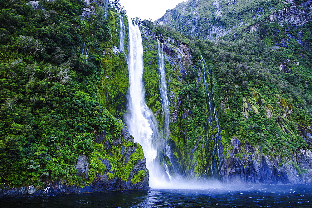 Huge waterfall in the Milford Sound, Fiordland National Park, UNESCO World Heritage Site, South Island, New Zealand, Pacific