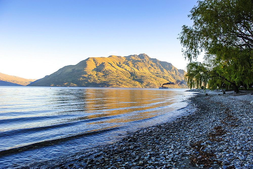 Late afternoon light over the shores of Lake Wakatipu, Queenstown, Otago, South Island, New Zealand, Pacific