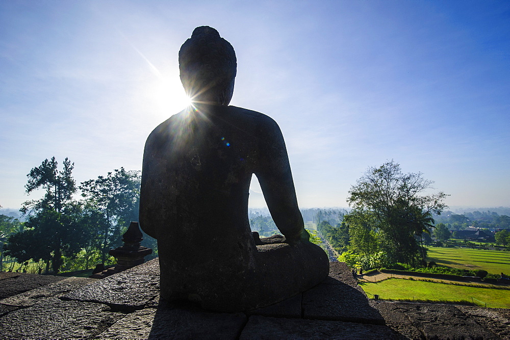 Backlight of a sitting Buddha in the temple complex of Borobodur, UNESCO World Heritage Site, Java, Indonesia, Southeast Asia, Asia