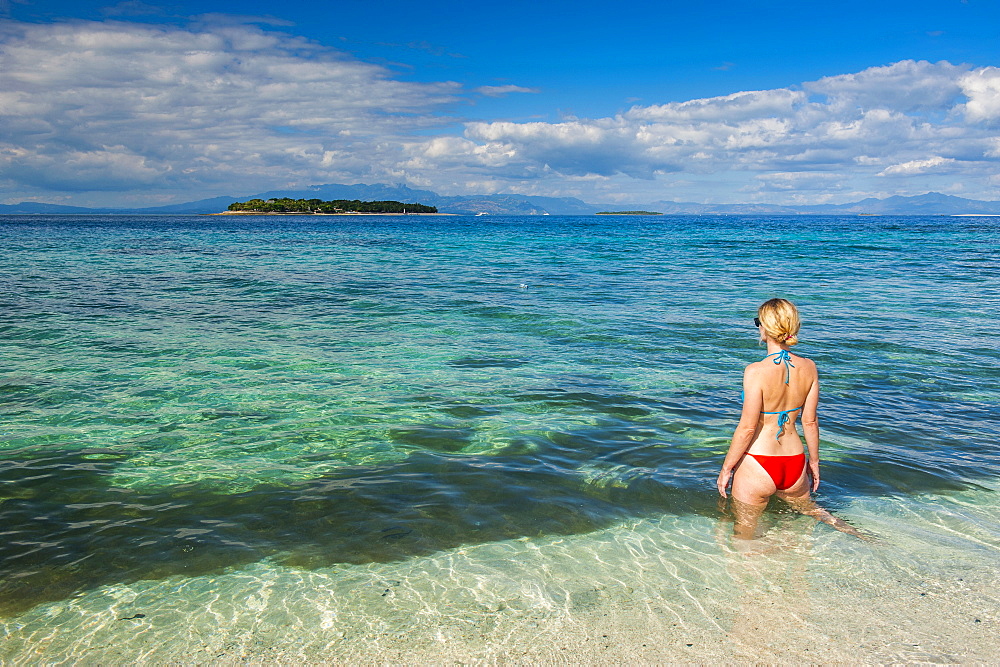 Woman standing in the clear water around Beachcomber Island, Mamanucas Islands, Fiji, South Pacific, Pacific