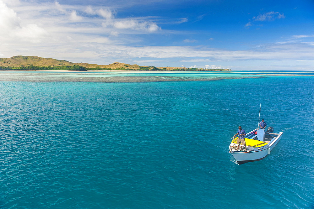 Little boat in the blue lagoon, Yasawas, Fiji, South Pacific, Pacific