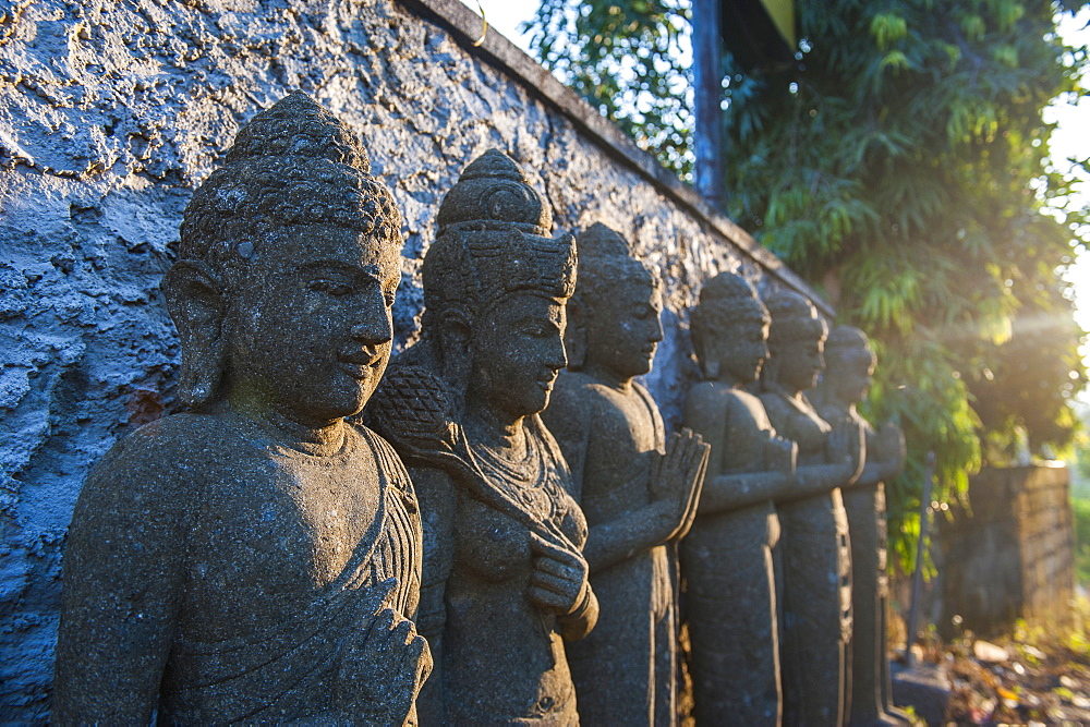 Late afternoon light on stone statues in the Pura Besakih temple complex, Bali, Indonesia, Southeast Asia, Asia