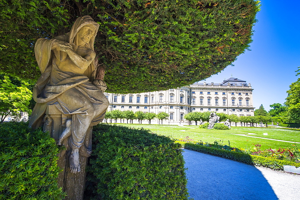 Statue under a tree in the Baroque gardens in the Wurzburg Residence, UNESCO World Heritage Site, Wurzburg, Franconia, Bavaria, Germany, Europe