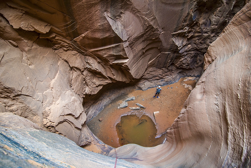 Man standing in a slot canyon after canyoneering, Moab, Utah, United States of America, North America