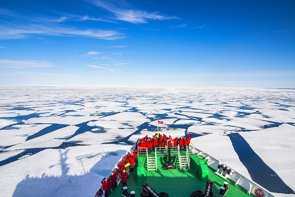 Expedition boat navigating through the pack ice in the Arctic shelf, Svalbard, Arctic