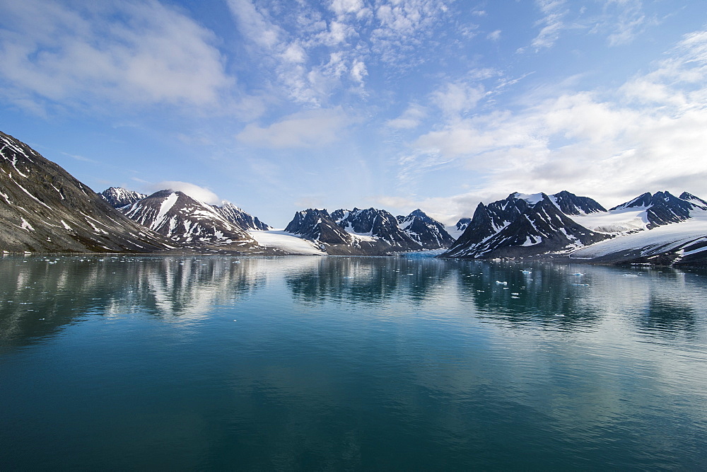 Mountains reflecting in the water in the Magdalenen Fjord, Svalbard, Arctic, Norway, Scandinavia, Europe 