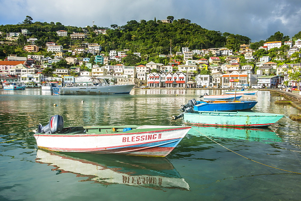 Little motoboat in the inner harbour of St. Georges, capital of Grenada, Windward Islands, West Indies, Caribbean, Central America