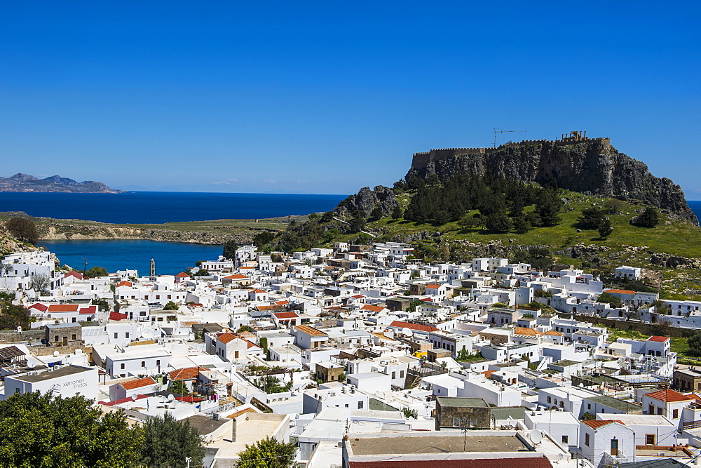 Panoramic view of beautiful Lindos village with its castle (Acropolis), Rhodes, Dodecanese Islands, Greek Islands, Greece, Europe