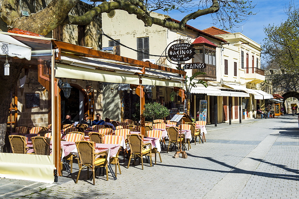 Street cafe in the Medieval Old Town, UNESCO World Heritage Site, City of Rhodes, Rhodes, Dodecanese Islands, Greek Islands, Greece, Europe