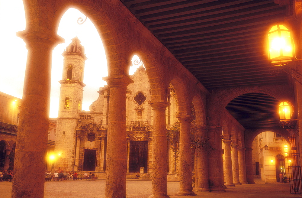 Plaza de la Catedral de San Cristobal de la Habana at dusk with diners at oudoor restaurant, Havana, Cuba, West Indies, Central America