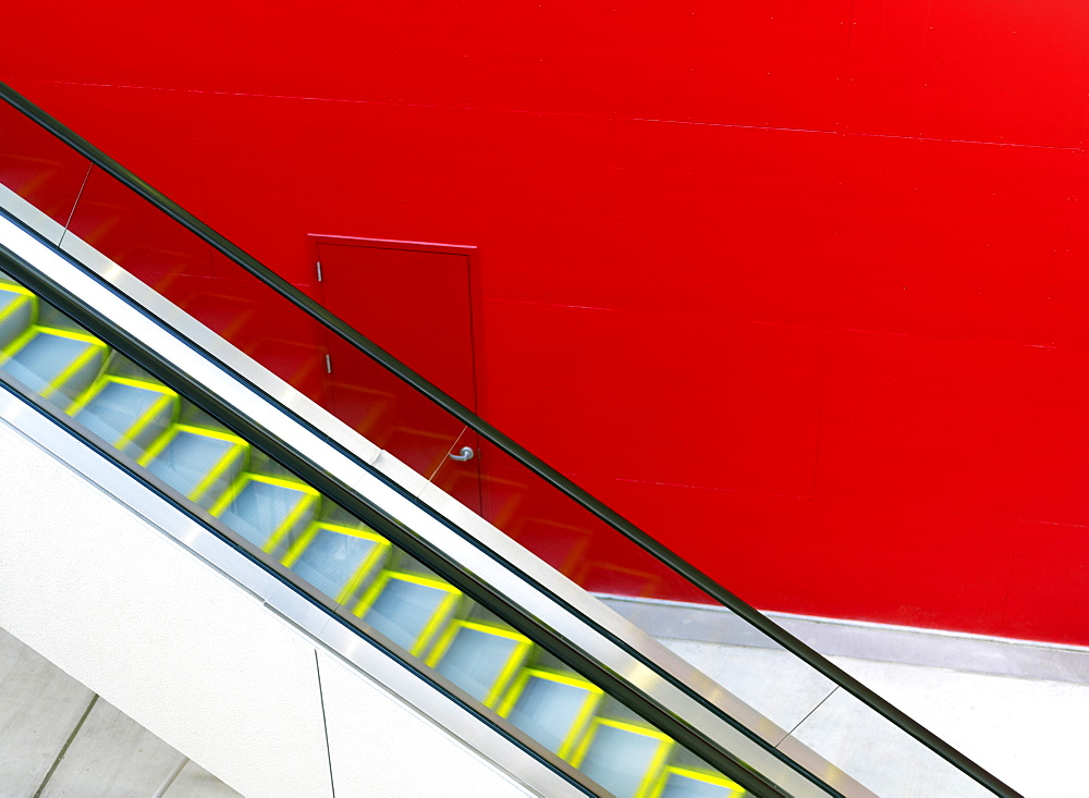 Escalator against a red painted wall, Houston, Texas, United States of America, North America