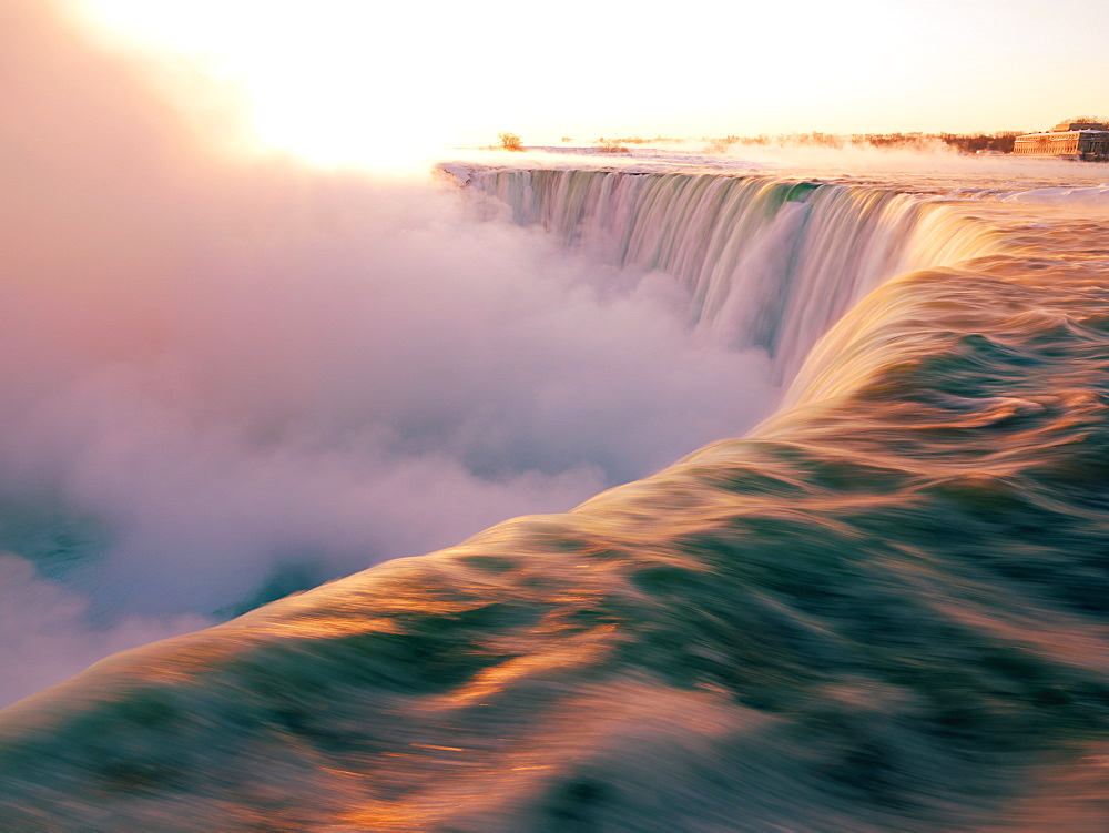 Brink of the Canadian Falls at sunrise in winter, Niagara Falls, Ontario, Canada, North America