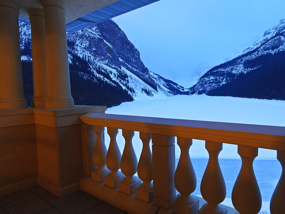 View of Lake Louise at dawn in winter from a suite at the Fairmont Chateau Lake Louise, Banff National Park, Alberta, Canada, North America