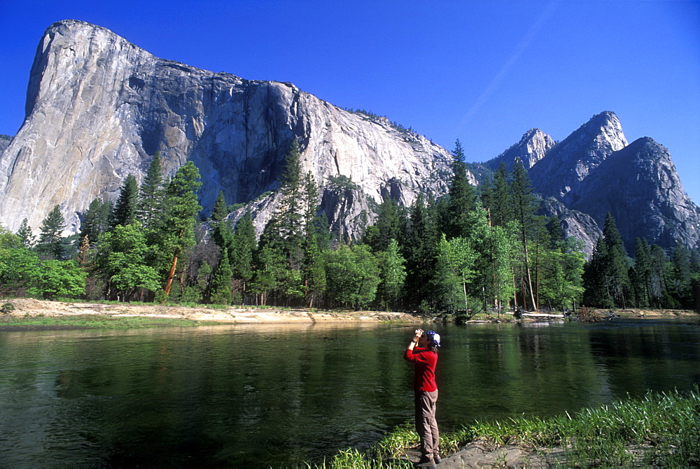 El Capitan and woman with binoculars, Yosemite National Park, UNESCO World Heritage Site, California, United States of America, North America