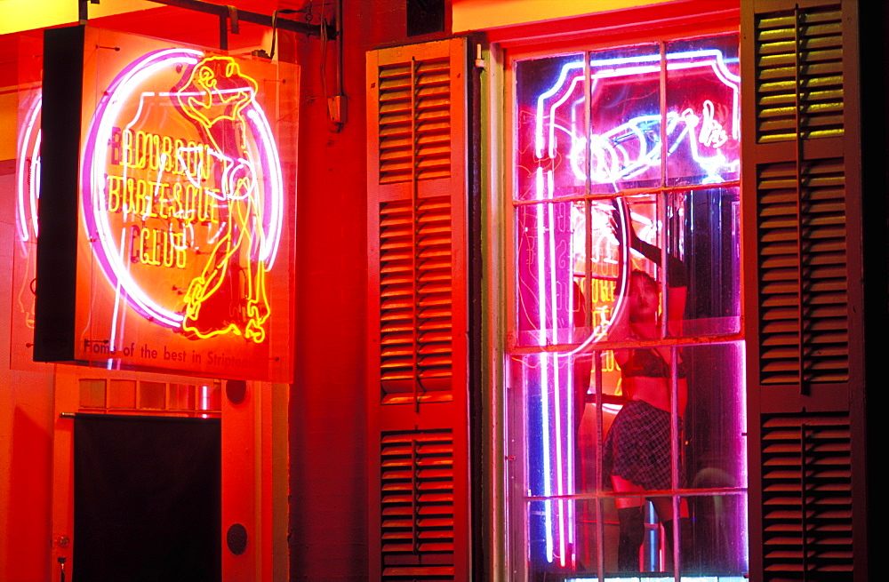 Strip club, Bourbon Burlesque Club with woman dancing in window, Bourbon Street, New Orleans, Louisiana, United States of America, North America