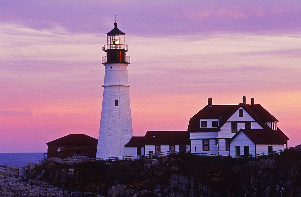 View of Portland Head Lighthouse and lighthouse keepers house at dusk, Cape Elizabeth, Maine, New England, United States of America, North America