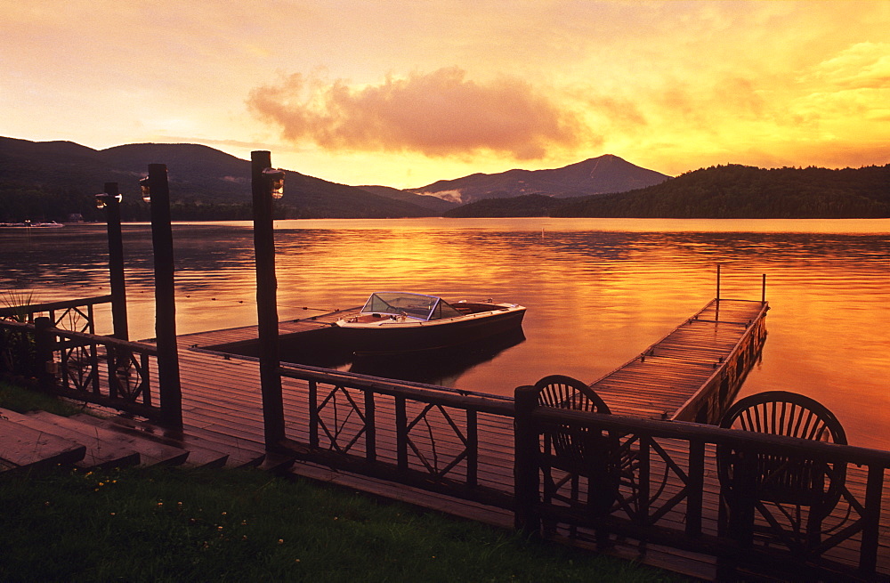 Motor boat moored at pier at dawn, Lake Placid, Adirondack State Park, New York State, United States of America, North America