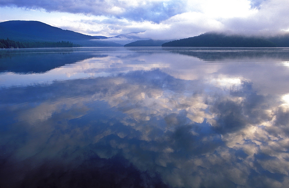 Reflection of clouds in the water of Lake Placid, Adirondack State Park, New York State, United States of America, North America