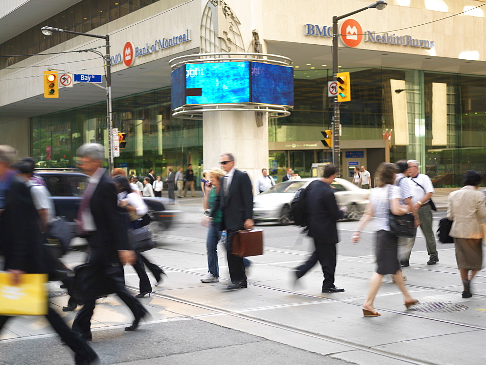 Pedestrians crossing street in the financial district of the city, Toronto, Ontario, Canada, North America