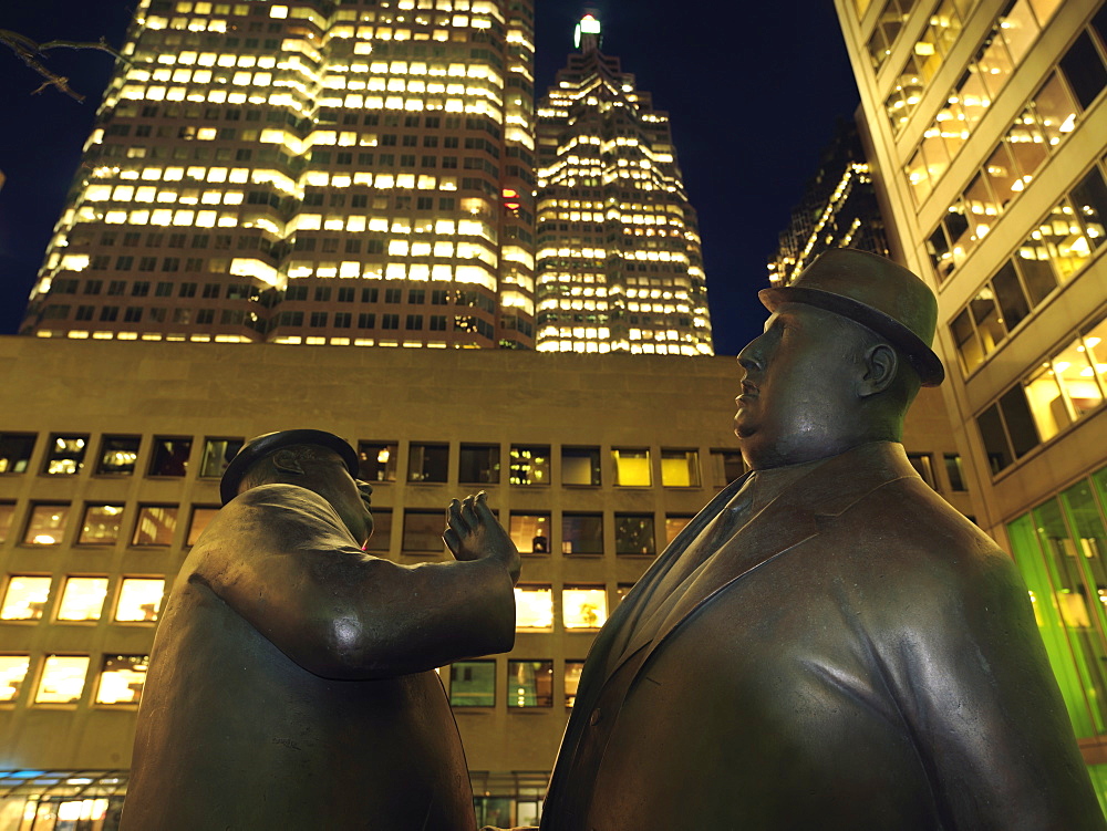 Encounter, a bronze sculpture by William McElcheran of two business men bumping into each other, Financial District, Toronto, Ontario, Canada, North America