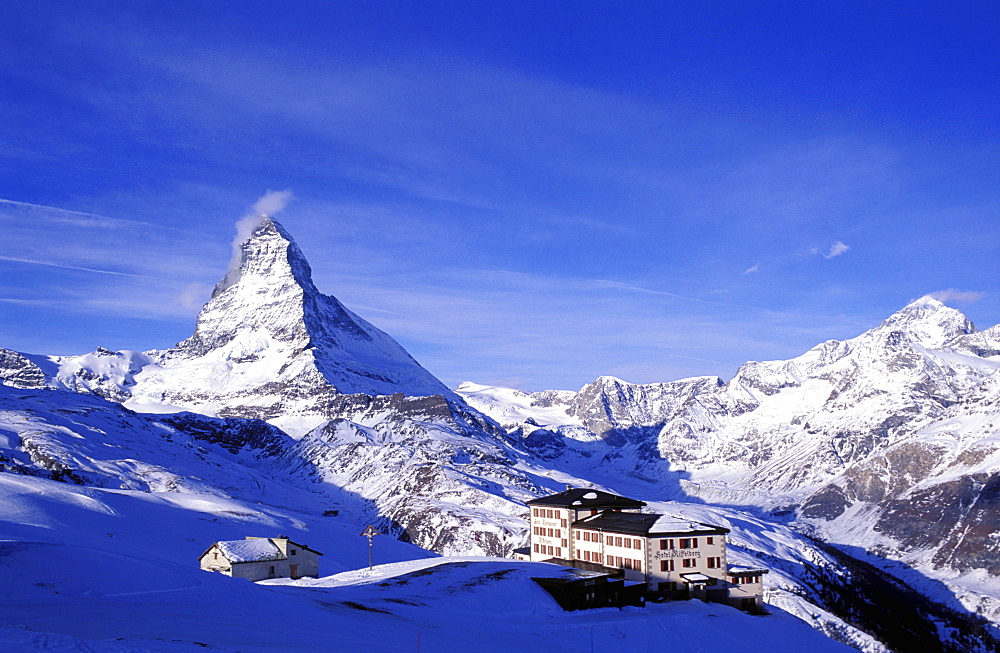 Hotel in the mountains with the Matterhorn in winter, Zermatt, Valais, Switzerland, Europe