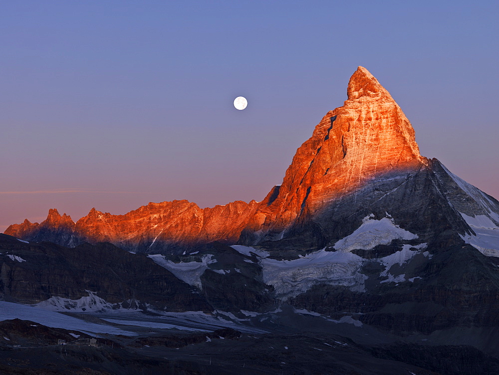 Moon setting over the Matterhorn at dawn, Gornergrat, Zermatt, Valais, Switzerland, Europe