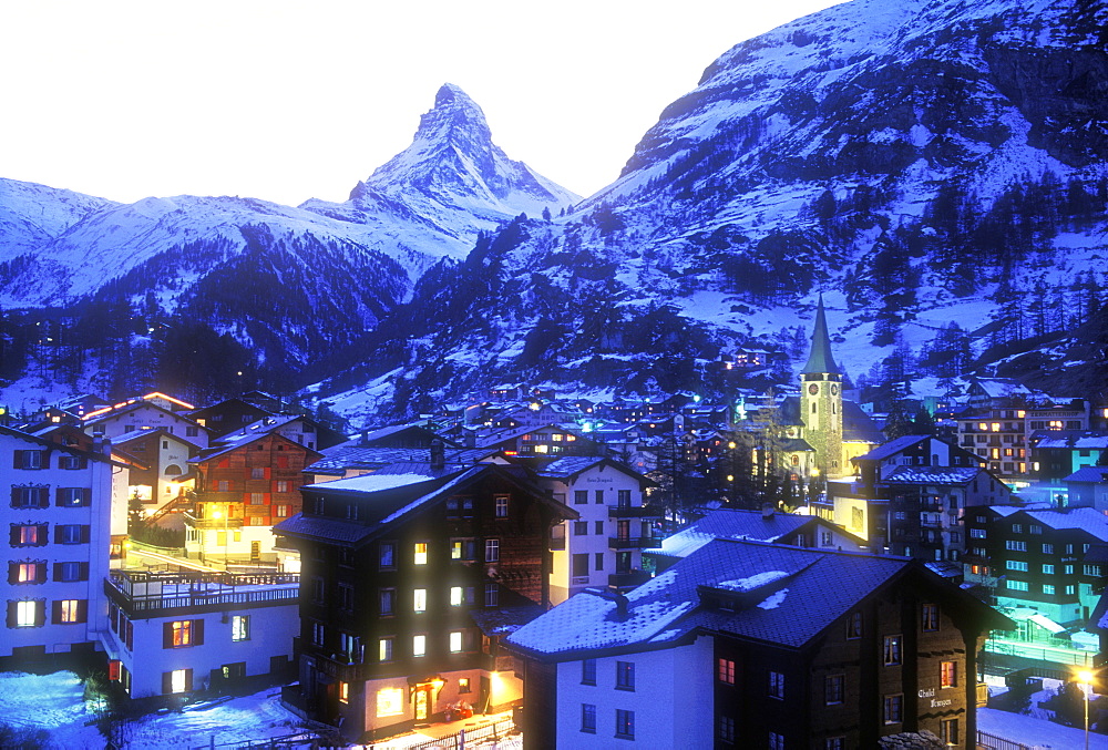 View of town at dusk with the Matterhorn, Zermatt, Valais, Switzerland, Europe