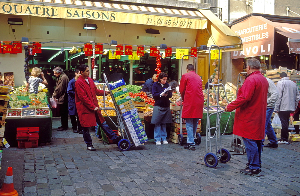 Fresh produce being unloaded at a street  market on Rue Cler, Paris, France, Europe