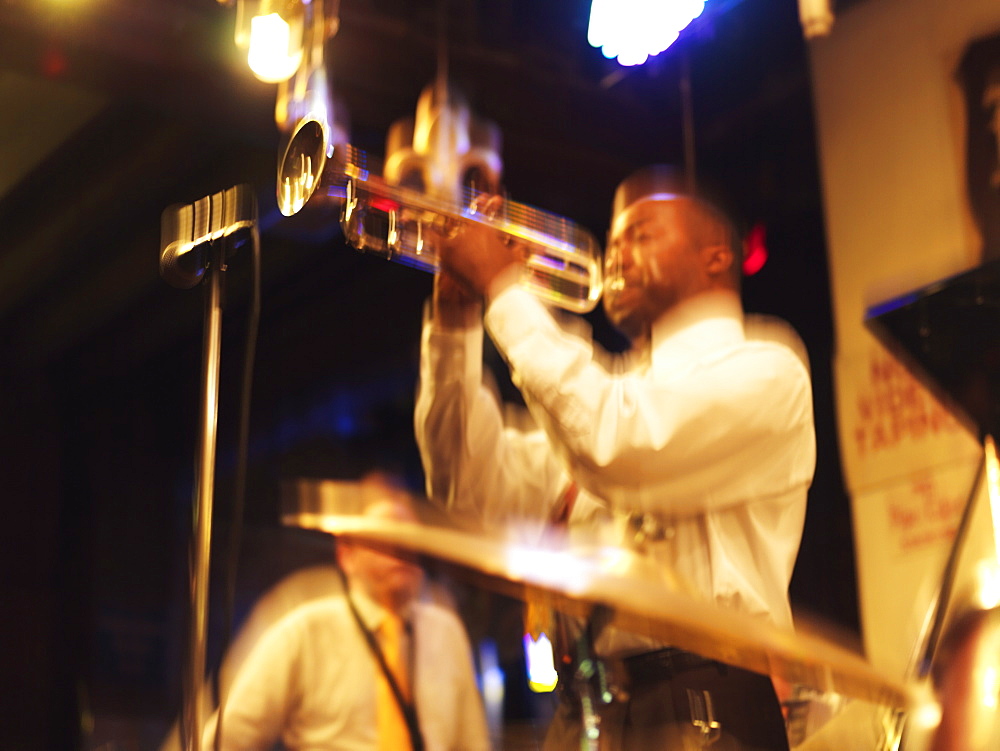 Jazz musician playing trumpet in a jazz club, French Quarter, New Orleans, Louisiana, United States of America, North America