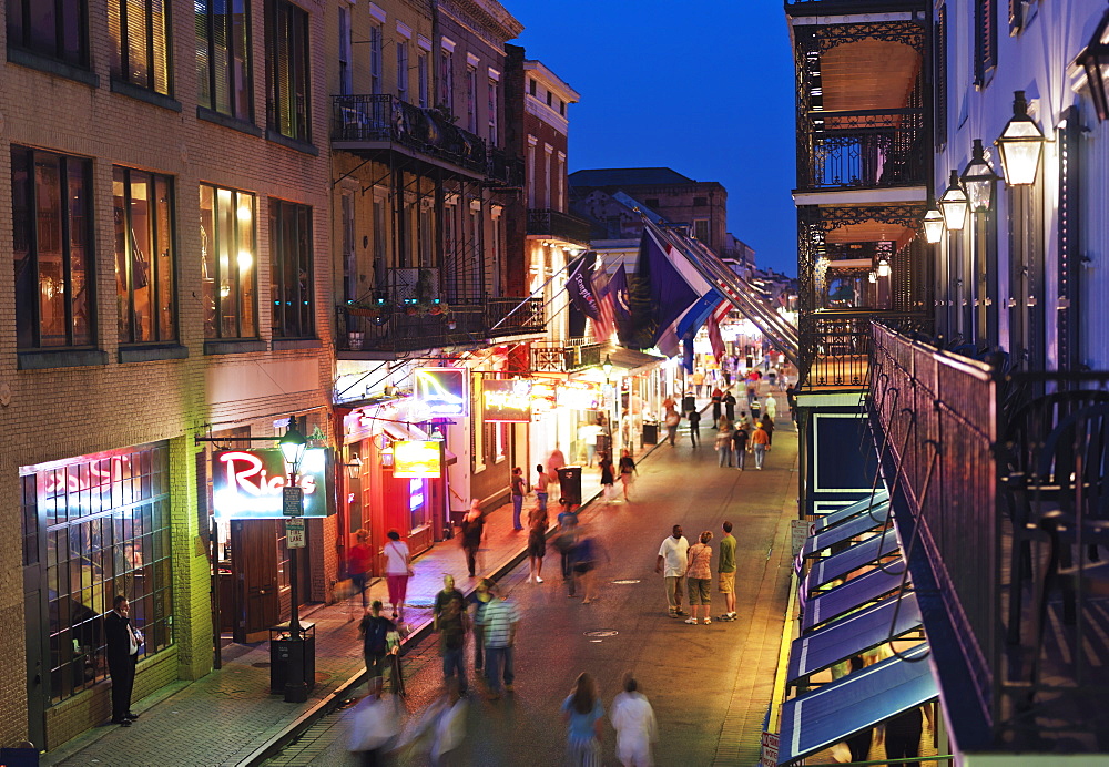 Bourbon Street at dusk with tourists, French Quarter, New Orleans, Louisiana, United States of America, North America