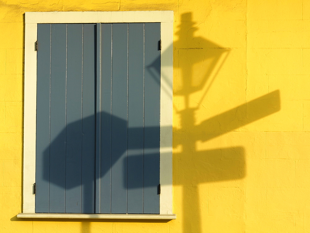 Shadow of French Quarter lamp post on a yellow wall, French Quarter, New Orleans, Louisiana, United States of America, North America