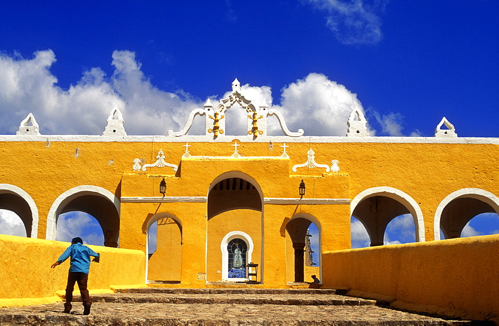 Young boy running up steps, Convento de San Antonio de Padua, Izamal, Yucatan, Mexico, North America