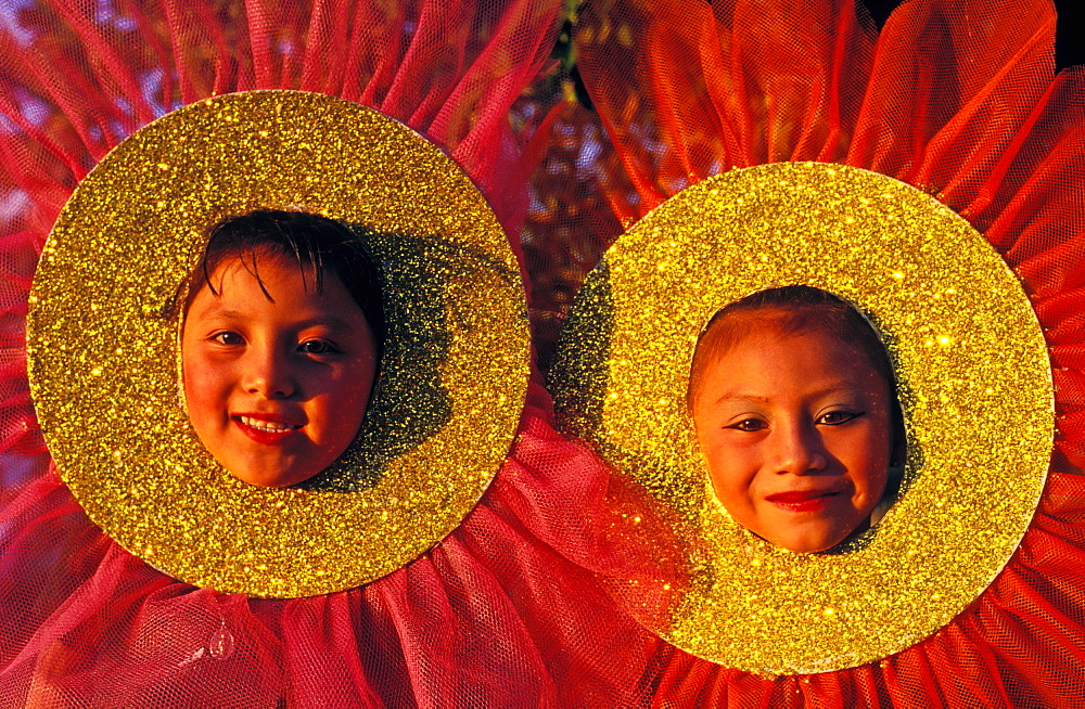 Two young girls in costume dressed as flowers celebrating a Rite of Spring celebration, Cozumel, Mexico, North America