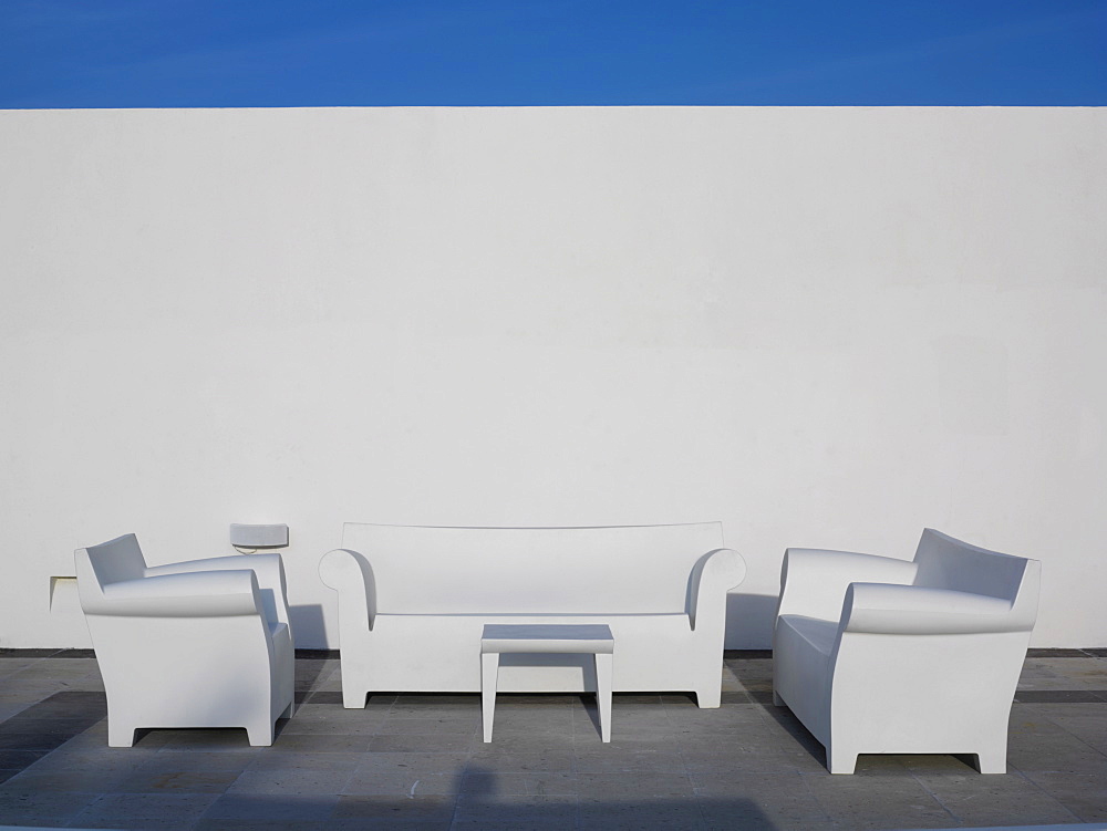 White chairs against a white wall and blue sky, Mayan Riviera, Akumal, Yucatan, Quintana Roo, Mexico, North America