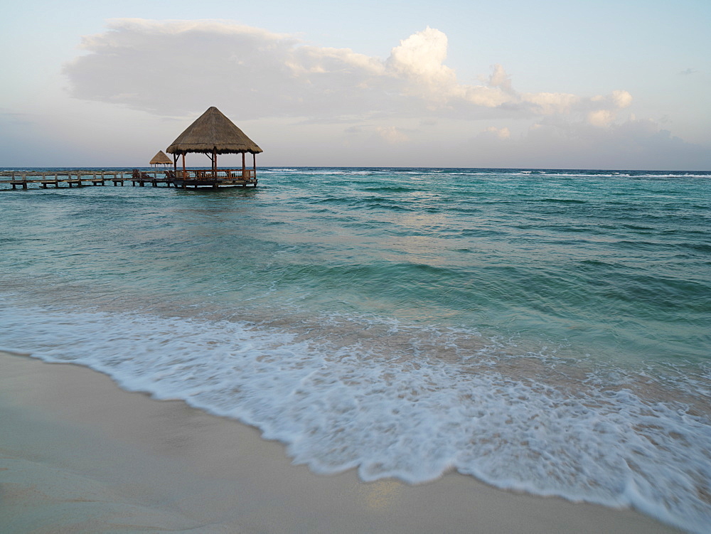 Pier with palapa jutting out into the water from the beach, Mayan Riviera, Akumal, Yucatan, Quintana Roo, Mexico, North America