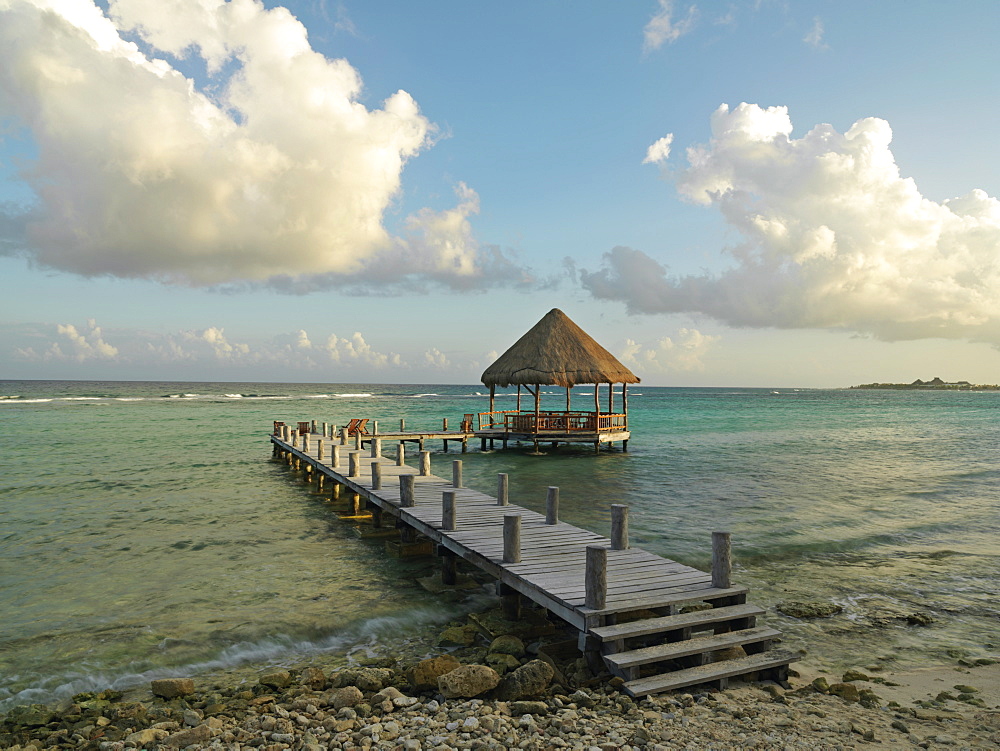 Pier with palapa jutting out into the water from the beach, Mayan Riviera, Akumal, Yucatan, Quintana Roo, Mexico, North America