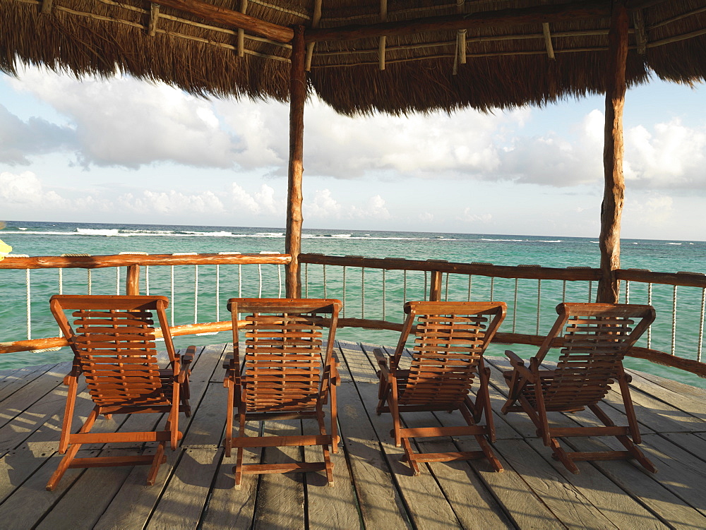 Deckchairs under a palapa, with view of the sea, Mayan Riviera, Akumal, Yucatan, Quintana Roo, Mexico, North America