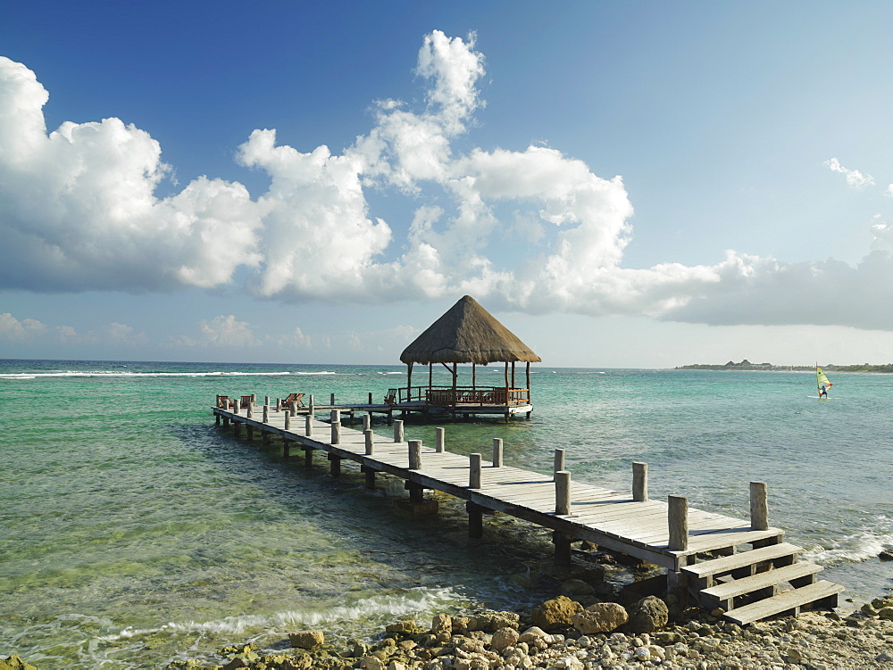 Pier with palapa jutting out into the water from the beach, Mayan Riviera, Akumal, Yucatan, Quintana Roo, Mexico, North America