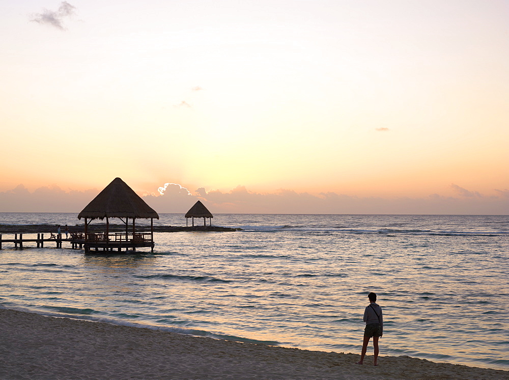 Person watching sunrise from the beach at sunrise, Mayan Riviera, Akumal, Yucatan, Quintana Roo, Mexico, North America