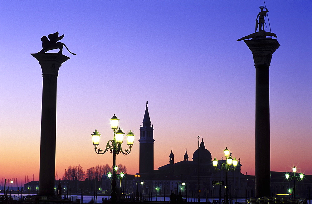 Columns of San Marco and San Teodoro with San Giorgio de Maggiore in the background at dawn, Venice, UNESCO World Heritage Site, Veneto, Italy, Europe