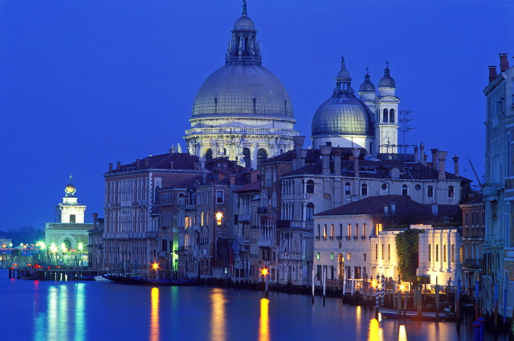 The Grand Canal with Santa Maria della Salute illuminated at night, Venice, UNESCO World Heritage Site, Veneto, Italy, Europe