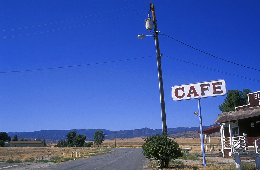 Cafe sign by the side of a rural road, Cuyama, California, United States of America, North America