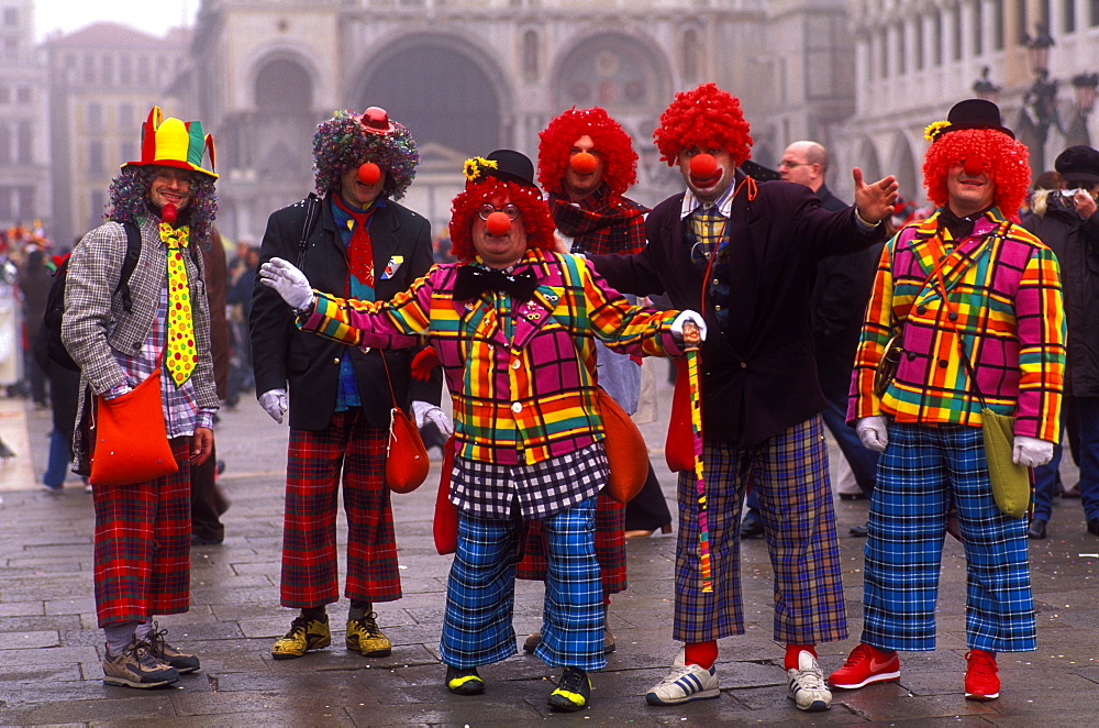 Clowns in the Piazza San Marco at Carnevale (Carnival), Venice, Veneto, Italy, Europe