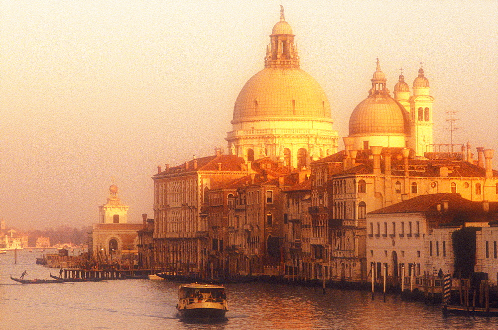 The Grand Canal with Santa Maria della Salute and a vaporetto, Venice, UNESCO World Heritage Site, Veneto, Italy, Europe