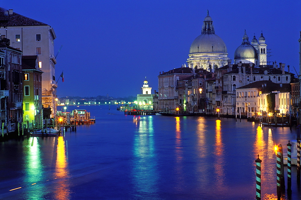 The Grand Canal with Santa Maria della Salute illuminated at night, Venice, UNESCO World Heritage Site, Veneto, Italy, Europe