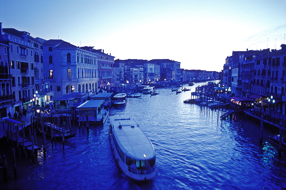 The Grand Canal at dusk in blue tones with vaparetto, Venice, UNESCO World Heritage Site, Veneto, Italy, Europe