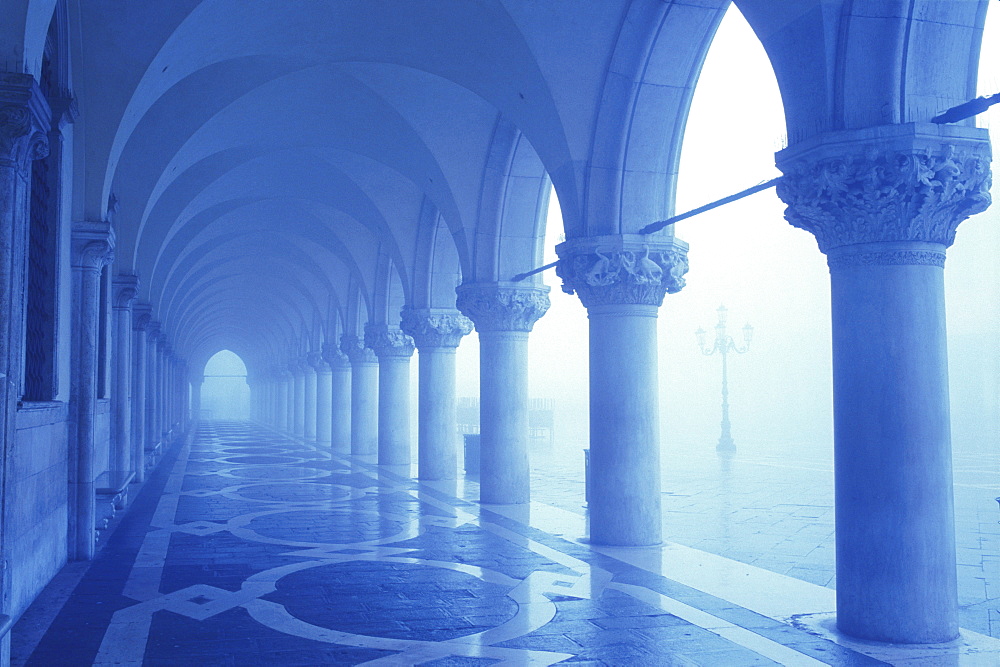 Columns and arches of the Doge's Palace in fog, Venice, UNESCO World Heritage Site, Veneto, Italy, Europe